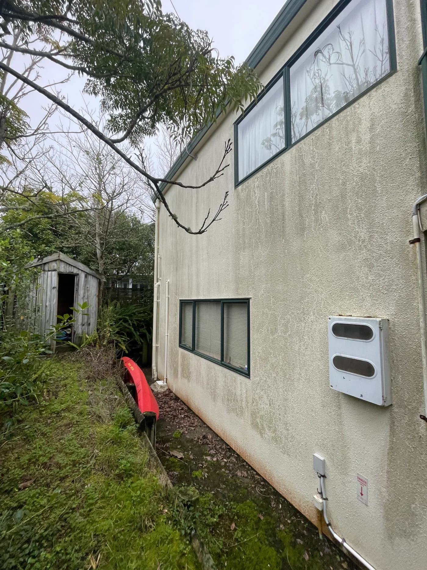 Textured house wall before Shoreline house washing